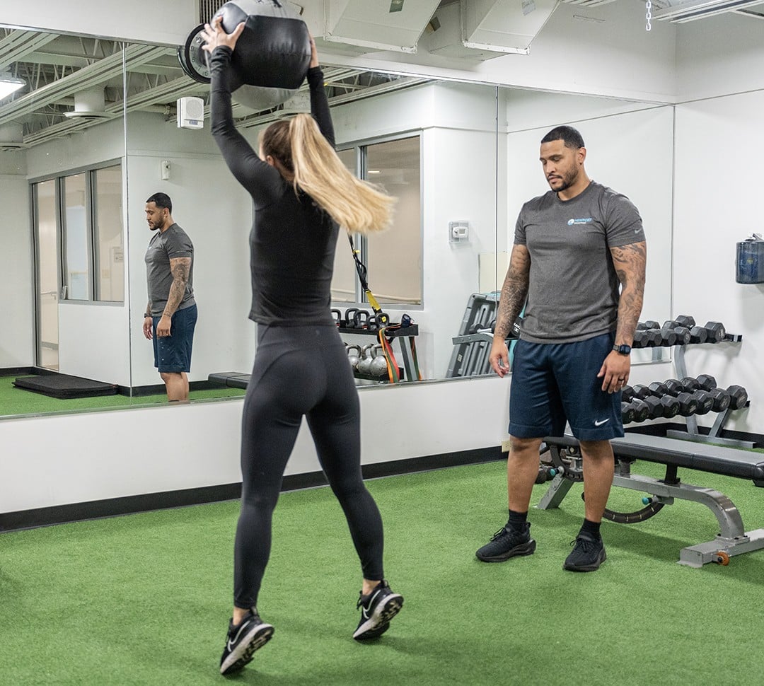 Member working out with medicine ball