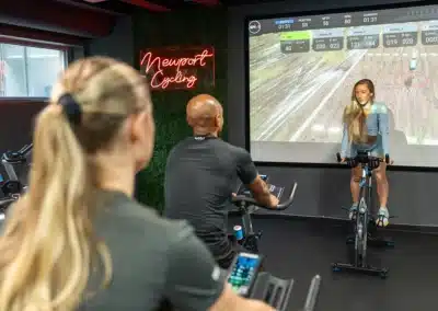 A spin class led by an instructor at Newport Swim and Fitness.