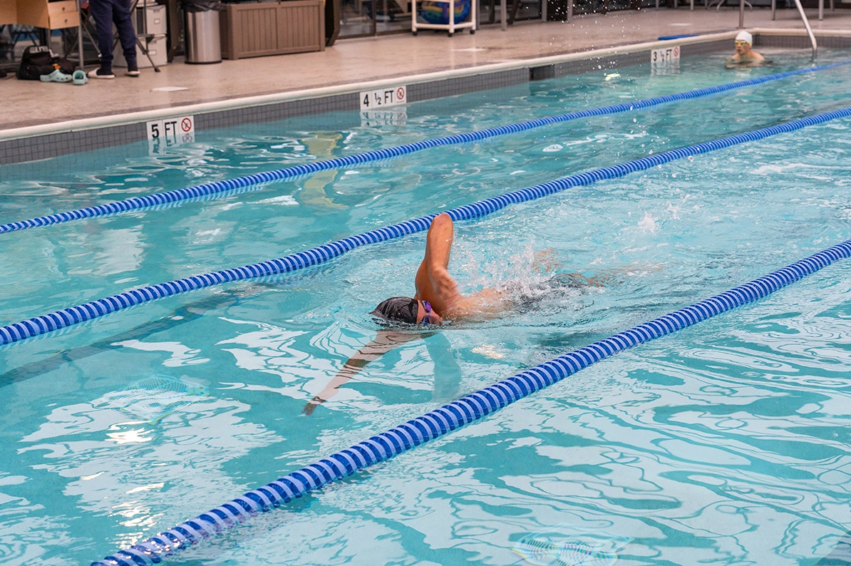 Swimmer performing laps in the pool at Newport Swim and Fitness.